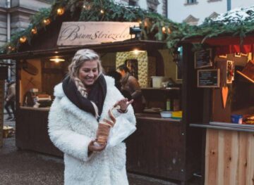 eating chimney cake in regensburg Christmas Markets